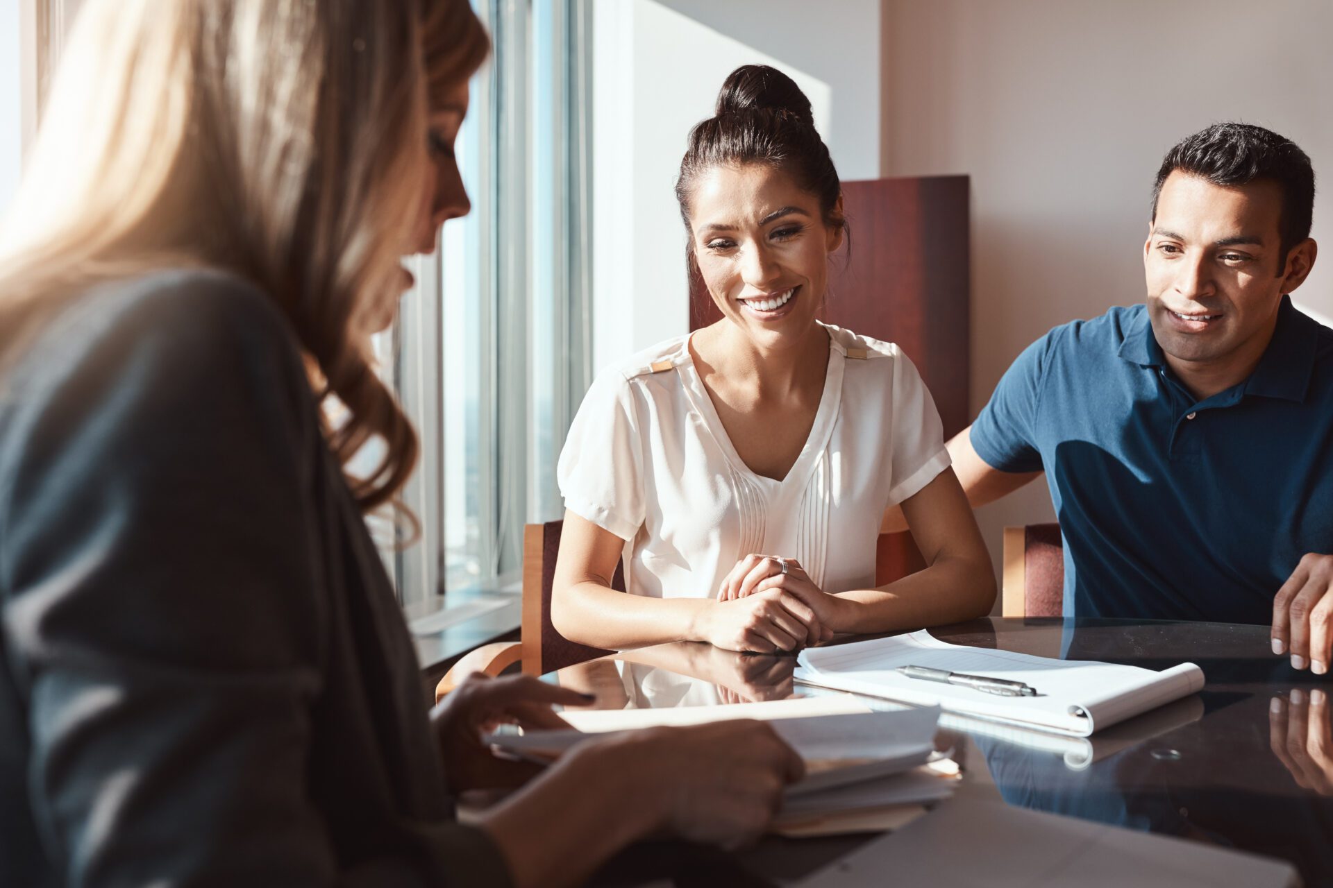 Making sound financial decisions for the sake of their future. a young couple meeting with a financial planner in a modern office